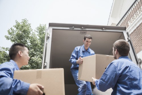 Local house removal team handling furniture and household items