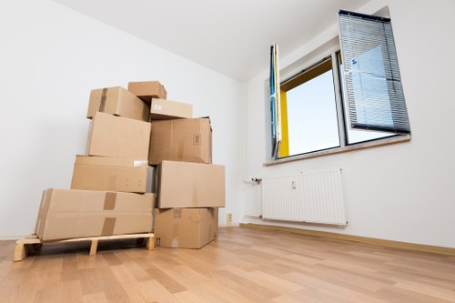 Packed moving boxes and furniture ready for a home move