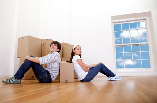 Careful wrapping of fragile household items during packing services in Hampton Hill