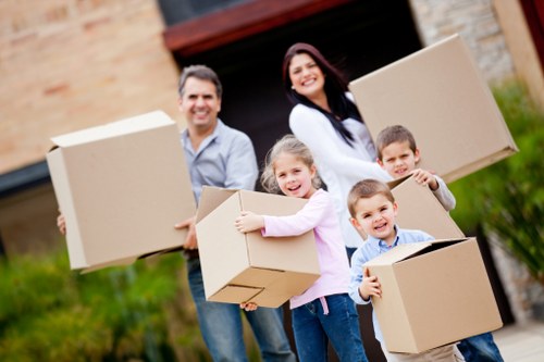 Local movers carrying furniture for a Hampton Hill home relocation