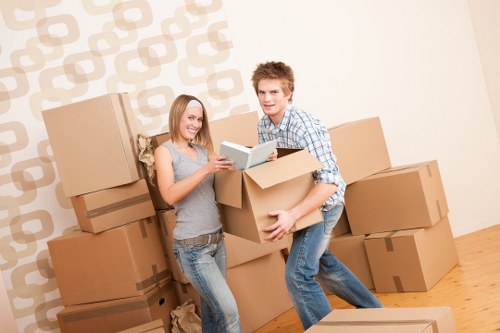 Packed office furniture and labelled boxes ready for a business move